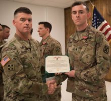 Myles Shoemaker with certificate