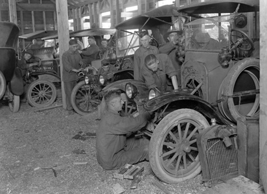 SATC members working on performing hands-on automotive repairs.