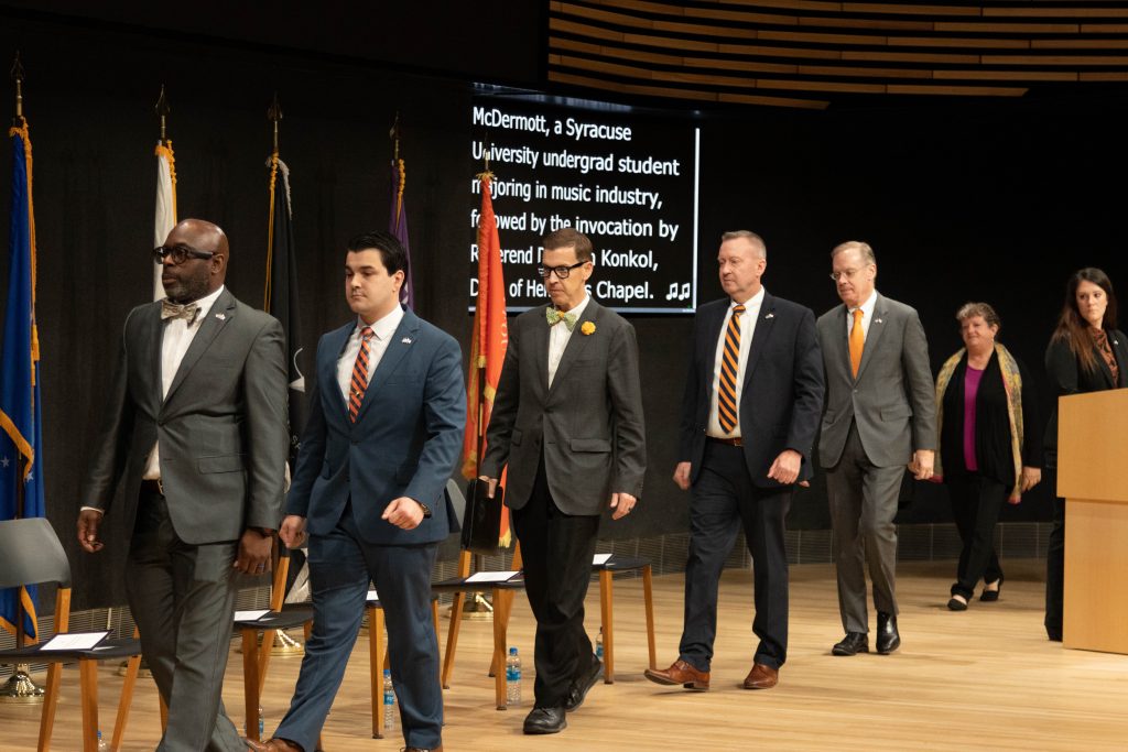 Speakers on stage at veterans day ceremony