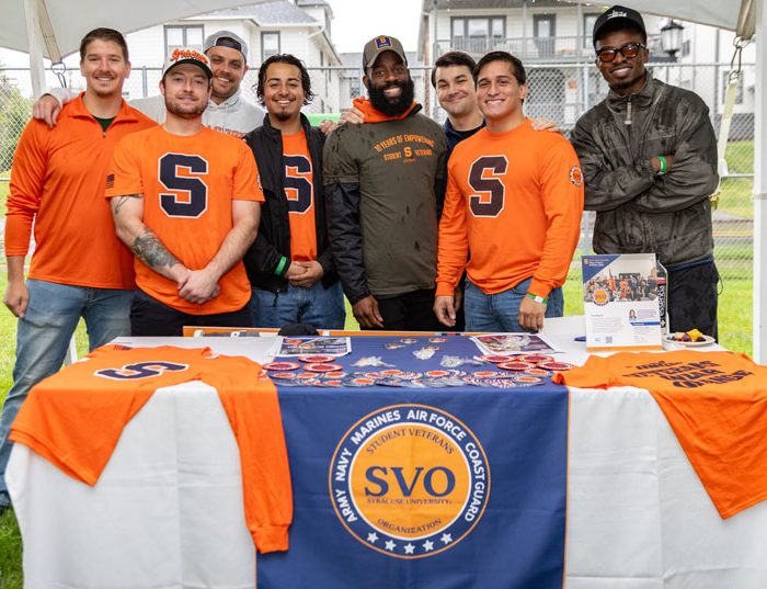 SVO students working a table at tailgate