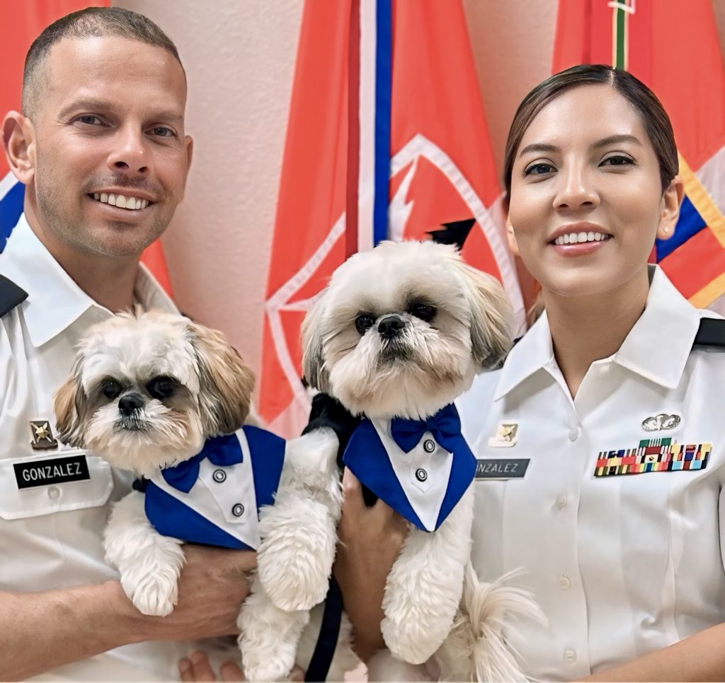 Tania Gonzalez with her husband and two dogs.
