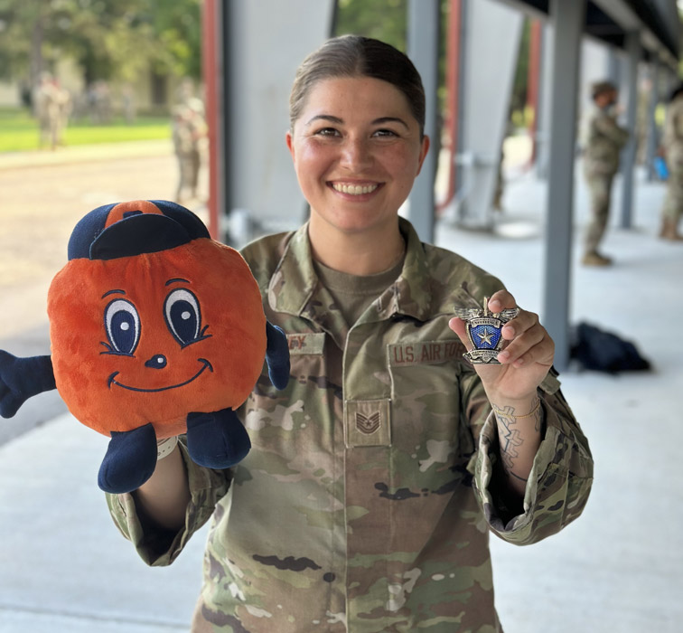 Alexis Stanely in uniform holding otto.