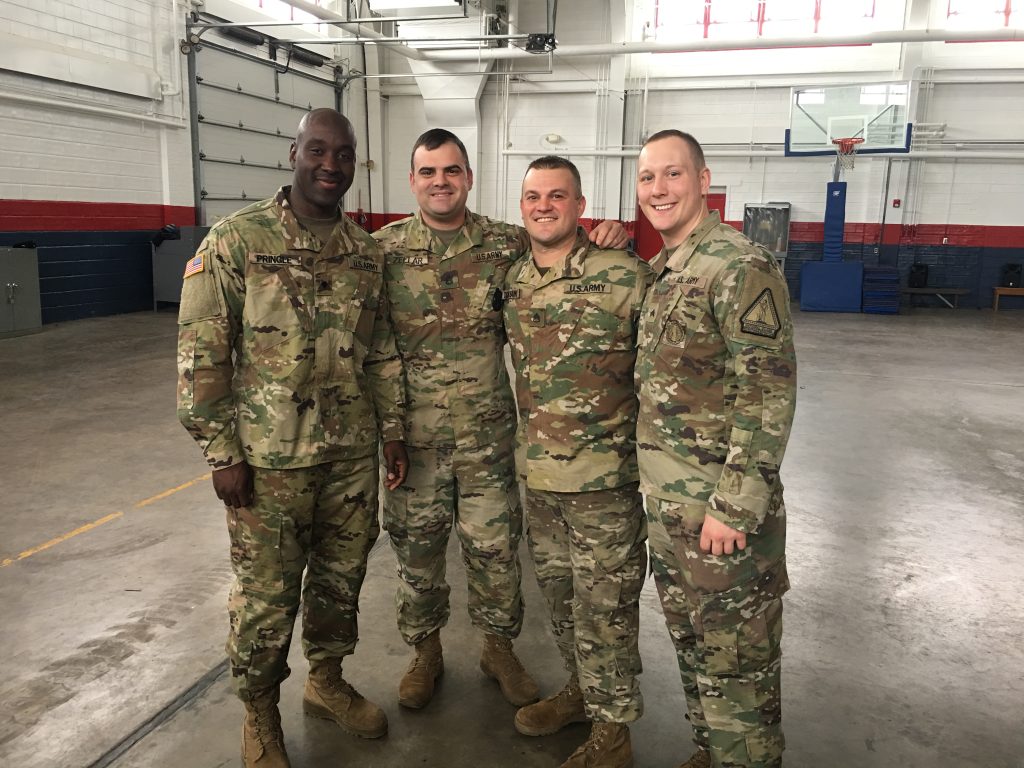 Andrew Zeller with friends in uniform.