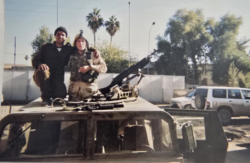 nick hardy in iraq on humvee.