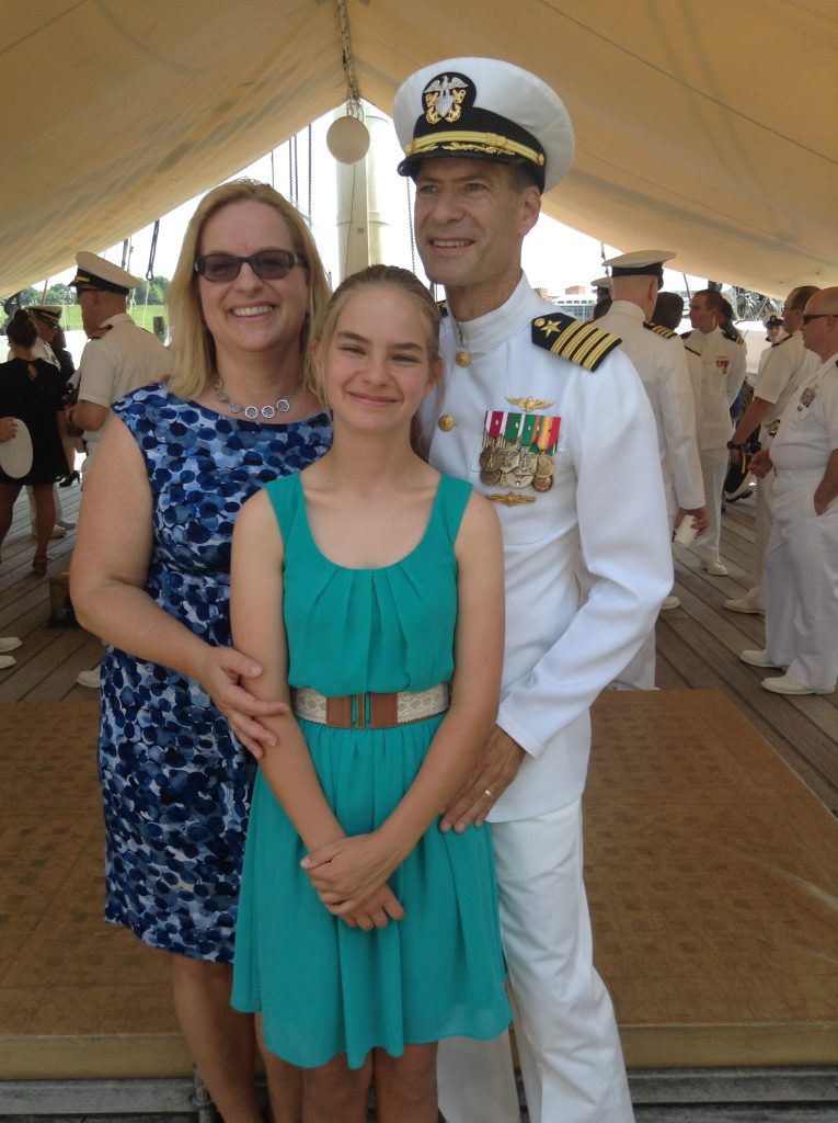Sabrina Lussier with her dad at his Navy Retirement