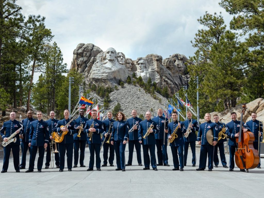airmen of note in front of the mount rushmore