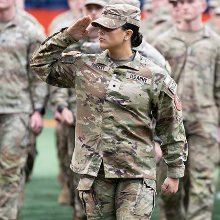 US Army ROTC Cadet saluting at chancellor's review in 2026.