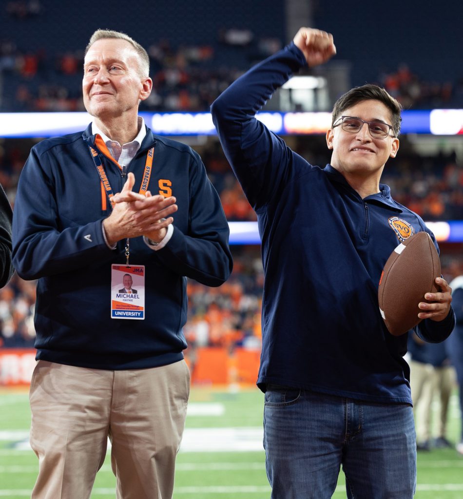 Leo Aviles celebrates with Haynie as he was honored as the Hometown Hero at the Nov. 1, 2025, football game. (Photo by Charlie Poag)