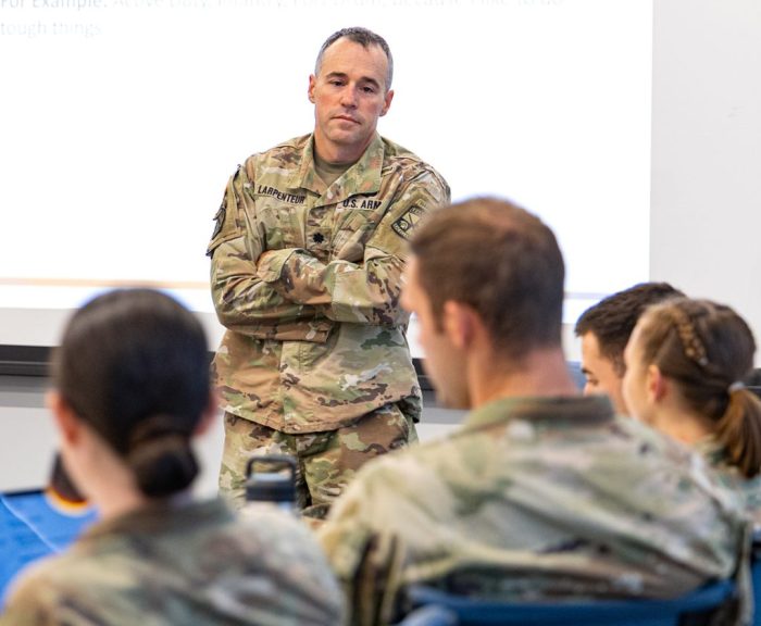 Lt.Col. Larpenteur teaching at front of classroom