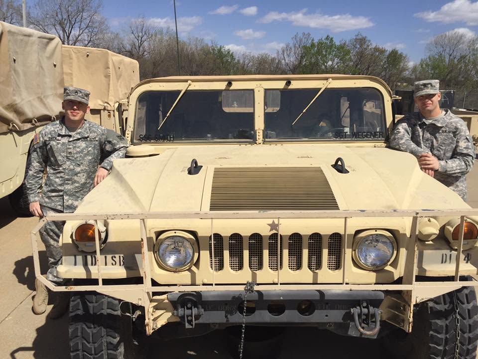 Scott wegener by military vehicle