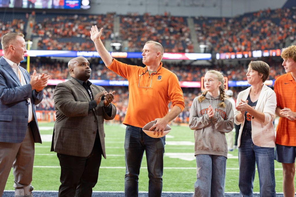AJ as hometown hero with his family on the Dome field.
